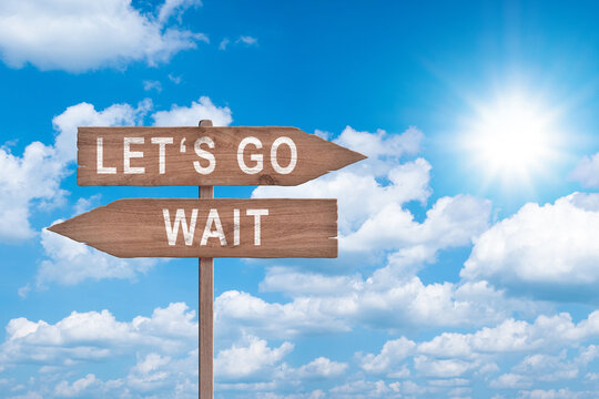 Standing at the crossroad making decision which way to go - Let's go or wait.