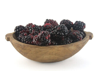 blackberry in wooden bowl white background