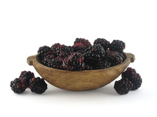 blackberry in wooden bowl white background