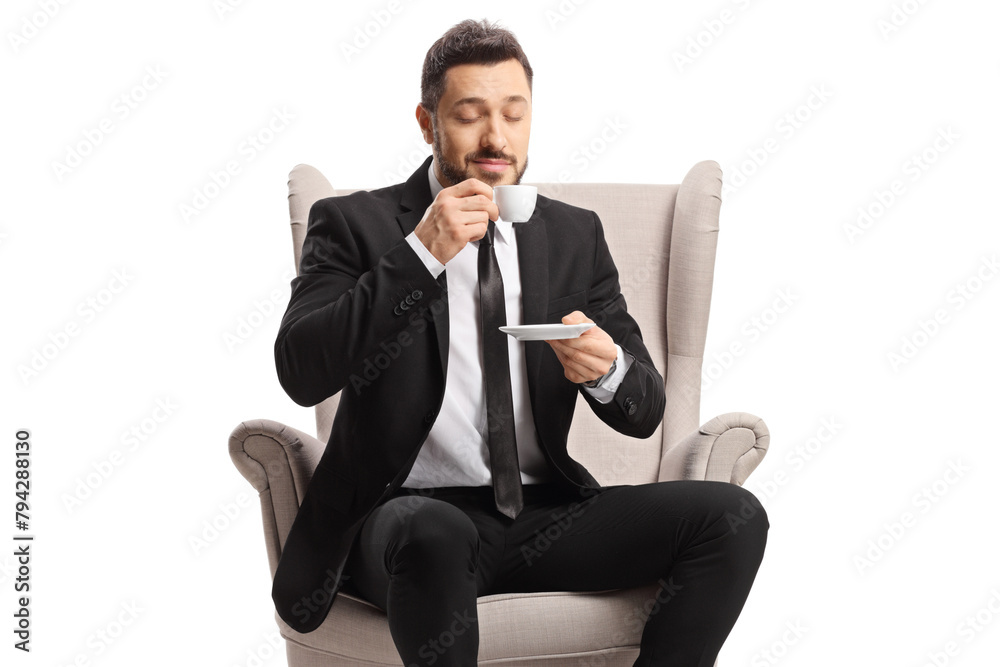 Canvas Prints businessman sitting in an armchair and drinking espresso coffee