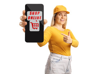 Young female pointing at a smartphone with text shop online