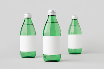 Water bottle mockup with a blank label. Green glass.