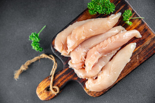 raw chicken meat aiguillettes fresh cooking appetizer meal food snack on the table copy space food background rustic top view keto or paleo diet