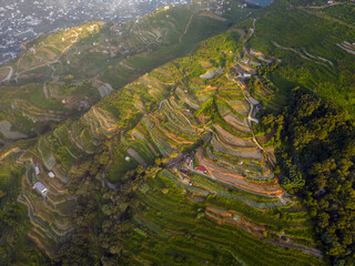 Aerial view at dawn from Mount Epomeo in Ischia. Flight in the clouds with a sea view