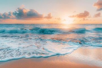 Fototapeta na wymiar Sunrise over a beach with waves gently breaking on sandy shore.