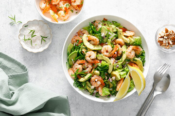 Shrimp avocado salad with lettuce and arugula, top view. - 794335316