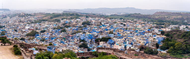 Panoramic aerial drone shot showing jodhpur blue city cityscape showing traditional houses in...
