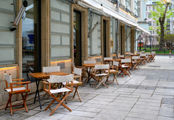 Street with tables of cafe in center of Moscow in Russia. Cozy cityscape in Moscow. Architecture...