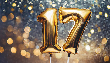 Banner with number 17 golden balloon. 17 years anniversary celebration. Dark glitter bokeh
