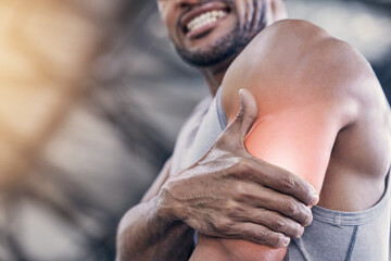 Man, arm muscle and pain with red bicep in gym from workout or exercise with joint hurt for...