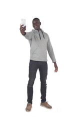 front view of a man taking a self-portrait with a smartphone on white background.