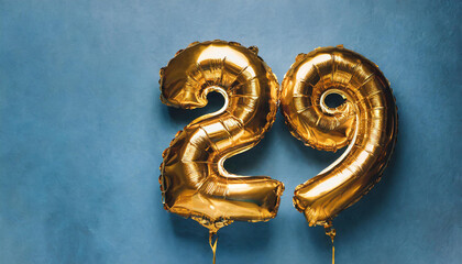 Banner with number 29 golden balloon. 29 years anniversary celebration. Bright blue background.