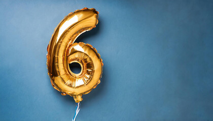 Banner with number 6 golden balloon. Six years anniversary celebration. Bright blue background.