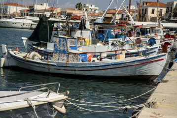 Fototapeta premium Greek boat on the background of the port on the island of Aegina