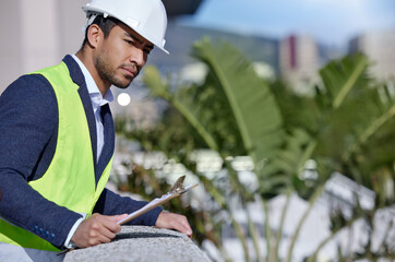 Man, engineer and clipboard for inspection at building site for management, serious and pride. Male...