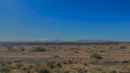View of the Desert and Mountains Afar