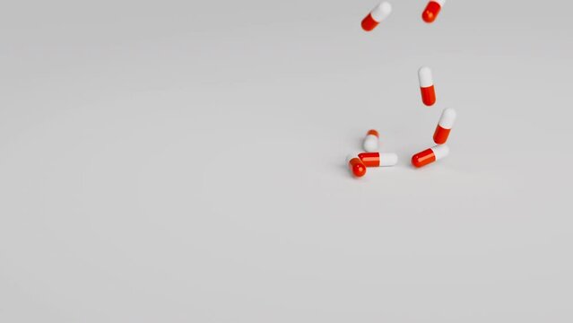 White and red pills falling on light background in slow motion. Drugs, pills, tablets, medicine concept. 3d render animation