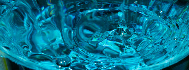 Water drop closeup while drops falling down and splashing into water in Jena