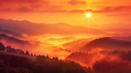 Obraz premium Breathtaking misty mountain sunrise in a serene and peaceful natural landscape with colorful orange hues. Tranquil beauty. And bright sunlight shining through the clouds