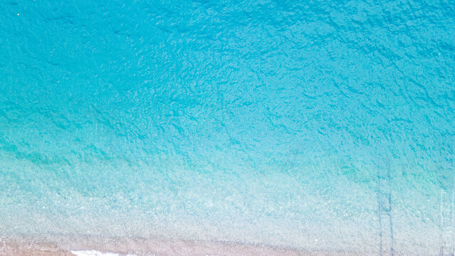 Aerial  view of the beach with sunbeds and umbrella at Kemer, Antalya by drone