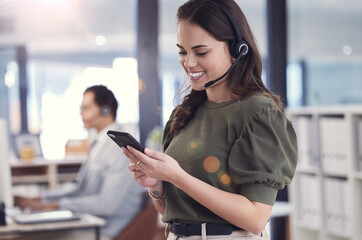 Woman, phone and headset with microphone in callcenter or customer care with smile and positivity....