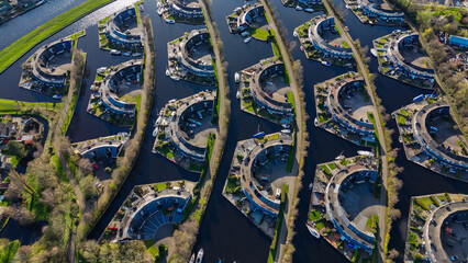 Aerial drone view geometric pattern of water houses, marina, yachts Marina Park Lemmer Netherlands