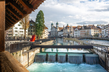 Needle dam at River Reuss with Jesuit Church - Lucerne, Switzerland