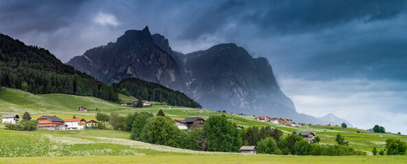 Panoramic dramatic image of scenery in the Dolomites. Summer in the Alpe di Siusi. Italy