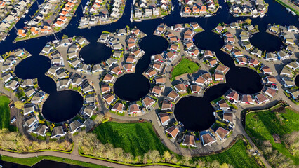 Aerial drone view geometric pattern of water houses, marina, yachts Marina Park Lemmer Netherlands