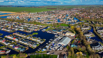 Aerial drone view geometric pattern of water houses, marina, yachts Marina Park Lemmer Netherlands
