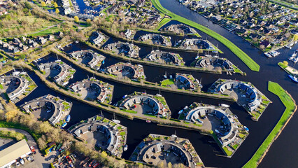 Aerial drone view geometric pattern of water houses, marina, yachts Marina Park Lemmer Netherlands