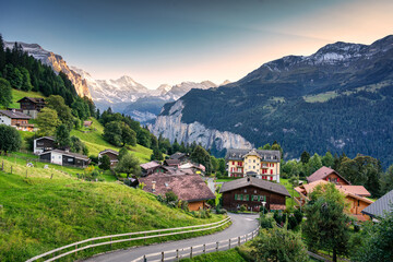 Wengen mountain village with Lauterbrunnen valley and Jungfrau mountain in the evening at Bern, Switzerland - obrazy, fototapety, plakaty