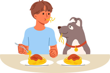 Little boy and dog eat spaghetti sitting at table, demonstrating friendship and trust. Child lives in harmony with dog, teaching puppy to accept food from plate and enjoying communication with pet