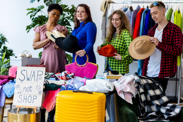 Friends trying clothes, glasses on home swap party - clothing exchange, garage sale. Vintage branded clothes finds, bargain hunting, second hand store shopping. Low prices, sustainable fashion