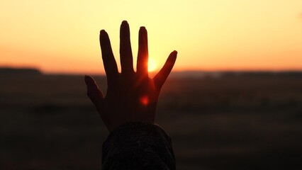 girl sunlight symbol, hand sun rays, sunbeam through fingers, dreamy sunset silhouette, prayer hope...