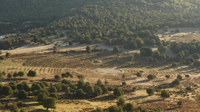 Green valley with restored grounds of Sad Hill Cemetery, the fictional round graveyard where the final duel of western The Good, The Bad and the Ugly takes place. View from above