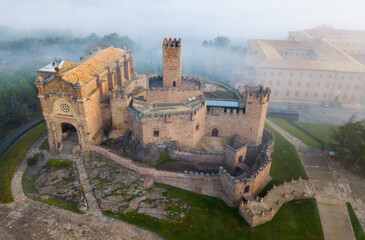 Picturesque autumn landscape with imposing medieval fortress Castillo de Javier, Spain..