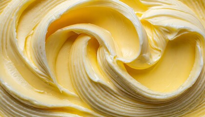 closeup view showcases a yellow texture of creamy butter or margarine as background