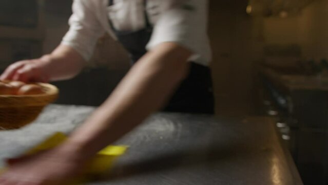 Chef Of A Restaurant Hygienically Cleans The Kitchen Before Work Service