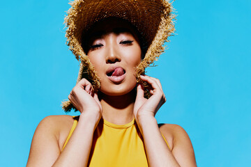 Lifestyle woman smile beauty lips trendy stylish summer cheerful yellow swimsuit portrait hat...