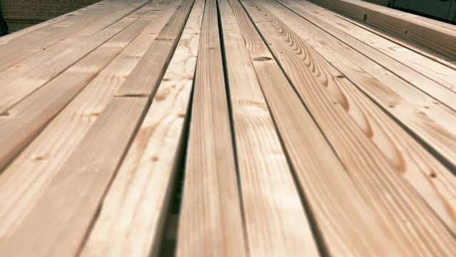 Close-Up of Freshly Stocked Rough Wood Board Piles at Lumber Warehouse