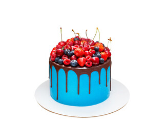 Beautiful blue birthday cake decorated with fresh berries with a place for a label. The concept of summer desserts for a birthday