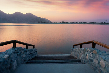 A beautiful sunset on the shore at lake Cahuilla, California.