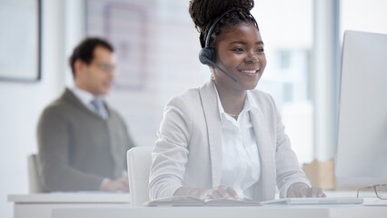 Employee, black woman and happy on computer at call center for customer or client support and service. Office, crm and advisor or consultant with smile or satisfied with job and career growth