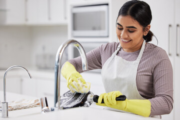 Smile, woman and washing dishes in home for cleaning, hygiene and routine housework in kitchen....