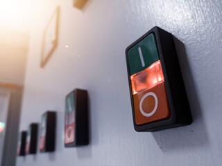 ON-OFF Switches with indicator light on in electrical panel control.