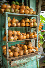 Tropical coconut display at rustic market stall