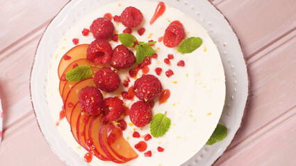 Cheesecake with fresh raspberries and plums