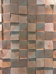 Wall of differently shaped wood blocks