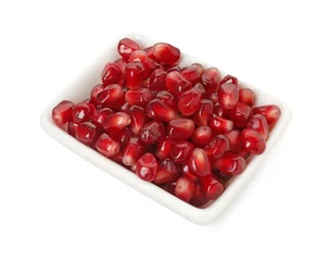 Foto op Aluminium Ripe juicy pomegranate grains in bowl isolated on white © New Africa